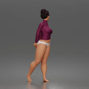 Standing woman looks back long sleeve top underwear bare feet