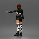 Woman Posing With Arm Extended In Crop Jacket Bralette Leather Shorts And Strappy Boots