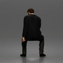 Seated Detective In Long Coat Holding Weapon In Contemplative Pose