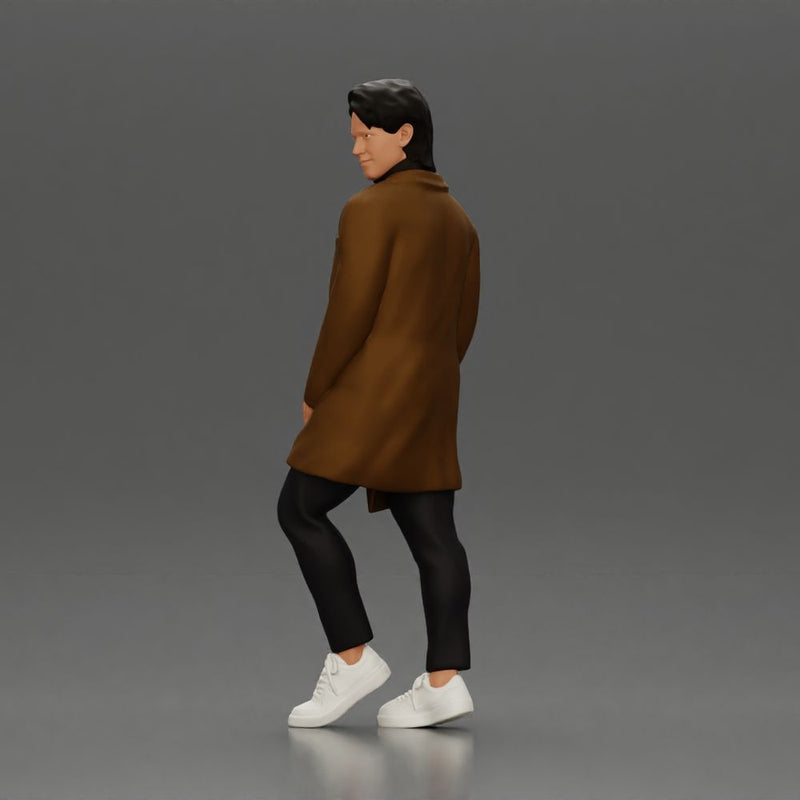 Man in brown coat glances sideways dressed in stylish winterwear - Only-Games