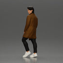 Man in brown coat glances sideways dressed in stylish winterwear - Only-Games