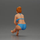 Woman sitting in Blue Bikini Ponders with Relaxed Posture - Only-Games