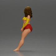 Woman in yellow top and red shorts leaning to wall - Only-Games