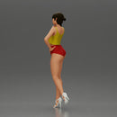Striking a flirty pose wearing yellow crop top red bottoms - Only-Games