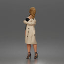 Woman Posing In Strapless Bodysuit With Long Coat And High Heel Sandals