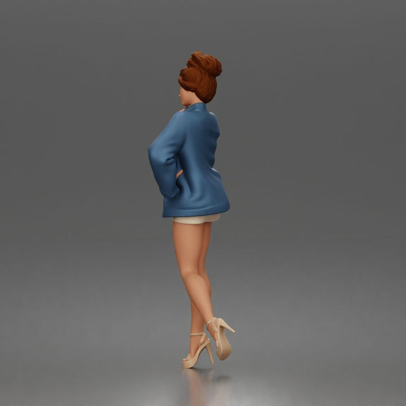 Elegant Woman Posing Confidently in Chic Jacket and Dress Outfit