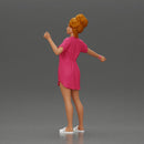 Woman in pink dress dancing joyfully with raised arms sideways - Only-Games