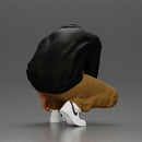 Man in hoodie crouching down tying shoelaces focused in casual outfit - Only-Games