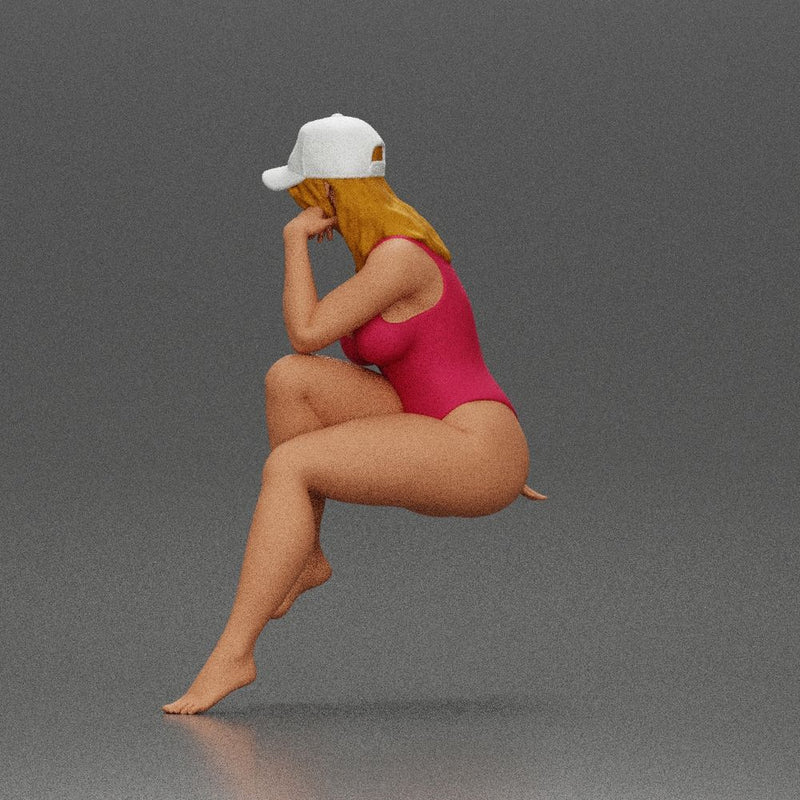 Woman in Swimsuit and Cap Sitting Thoughtfully in Relaxed Pose - Only-Games
