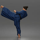 Man Performing Martial Arts High Kick Pose Gi Uniform Belt Barefoot Outfit