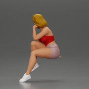 Confident Blonde Woman Sitting Gracefully in Red and Pink - Only-Games