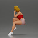 Confident Blonde Woman Sitting Gracefully in Red and Pink - Only-Games