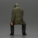 Man in hooded jacket sits alone holding gun feeling troubled - Only-Games