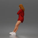 leaning woman folds arms open shirt swimwear bottoms and sneakers