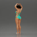 Brunette woman in turquoise swimsuit stretching with elegant ballet pose - Only-Games