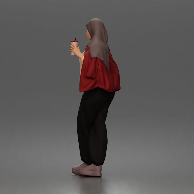 hijabi woman sipping takeaway drink in modern casual streetwear style - Only-Games
