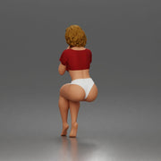 Sitting Woman Clasping Hands Near Chin In Crop Top Bottoms - Only-Games