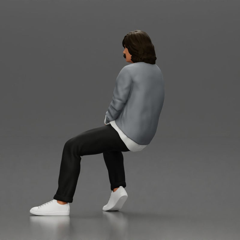 Man in Casual Sweater and Sneakers Sitting with Relaxed Posture - Only-Games