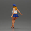 Stylish woman sitting casually in a white top and blue skirt - Only-Games