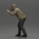 Man in hoodie pointing gun while raising hand in defensive gesture - Only-Games