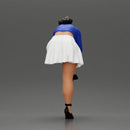 Young woman in skirt adjusts her elegant black high heeled shoes - Only-Games