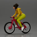 Sporty girl riding a red bike in bright yellow tracksuit - Only-Games