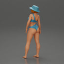 Stylish woman modeling modern asymmetric bikini and hat - Only-Games