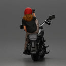 Biker woman in red helmet striking pose on black motorcycle - Only-Games