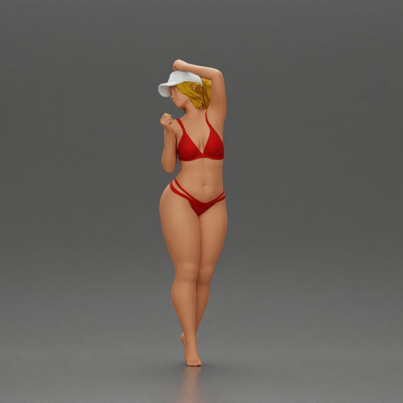 Stylish woman confidently posing in red bikini and white cap - Only-Games