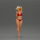 Stylish woman confidently posing in red bikini and white cap - Only-Games