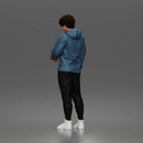 Casual Young Man Standing Relaxed in Hoodie, Joggers, and Sneakers
