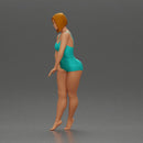 woman in a turquoise swimsuit striking a pose - Only-Games