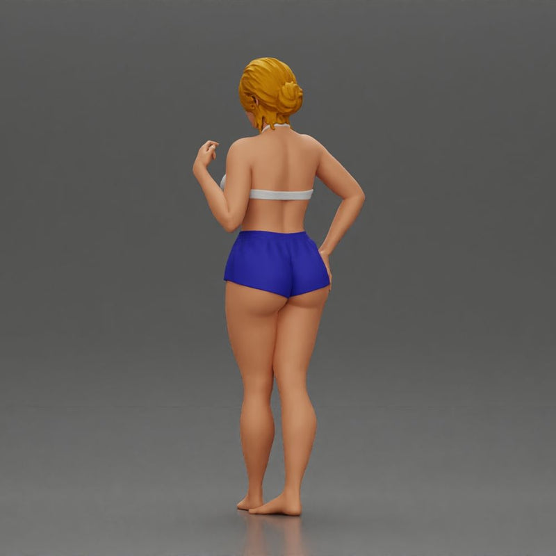 woman posing barefoot wearing bikini top and shorts stylishly - Only-Games