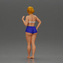 woman posing barefoot wearing bikini top and shorts stylishly - Only-Games