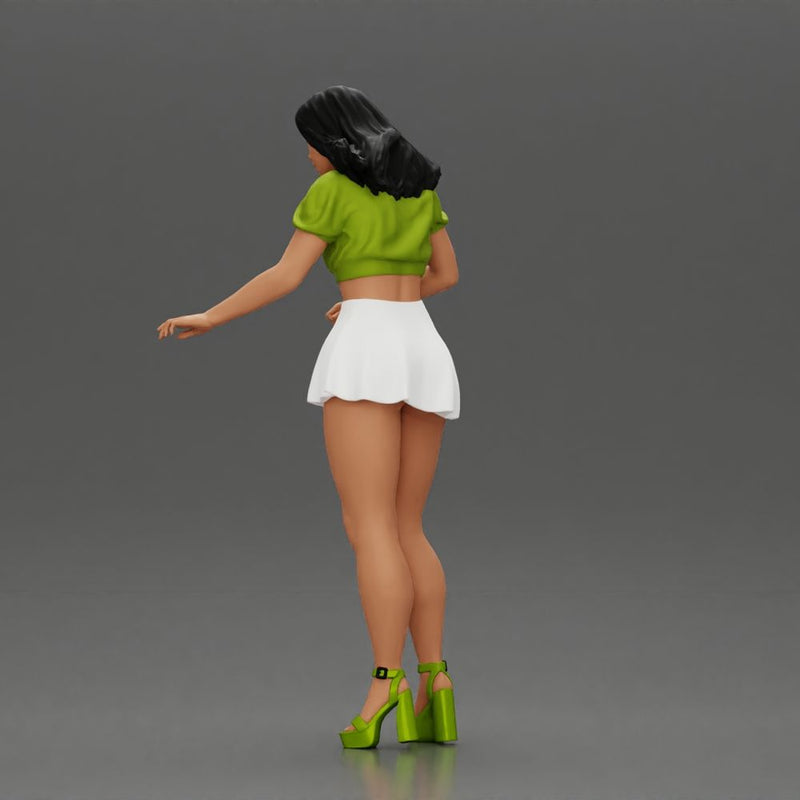 woman standing with a green top white skirt looking like they want to hold something - Only-Games