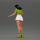 woman standing with a green top white skirt looking like they want to hold something - Only-Games