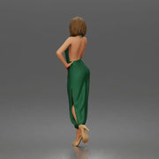 Woman poses thoughtfully lifting heel wearing halter jumpsuit with platform heels - Only-Games