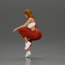 Street dancer in red overalls sitting stylishly on parked car - Only-Games