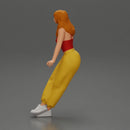 Woman sitting on car in red top yellow pants striking playful pose - Only-Games