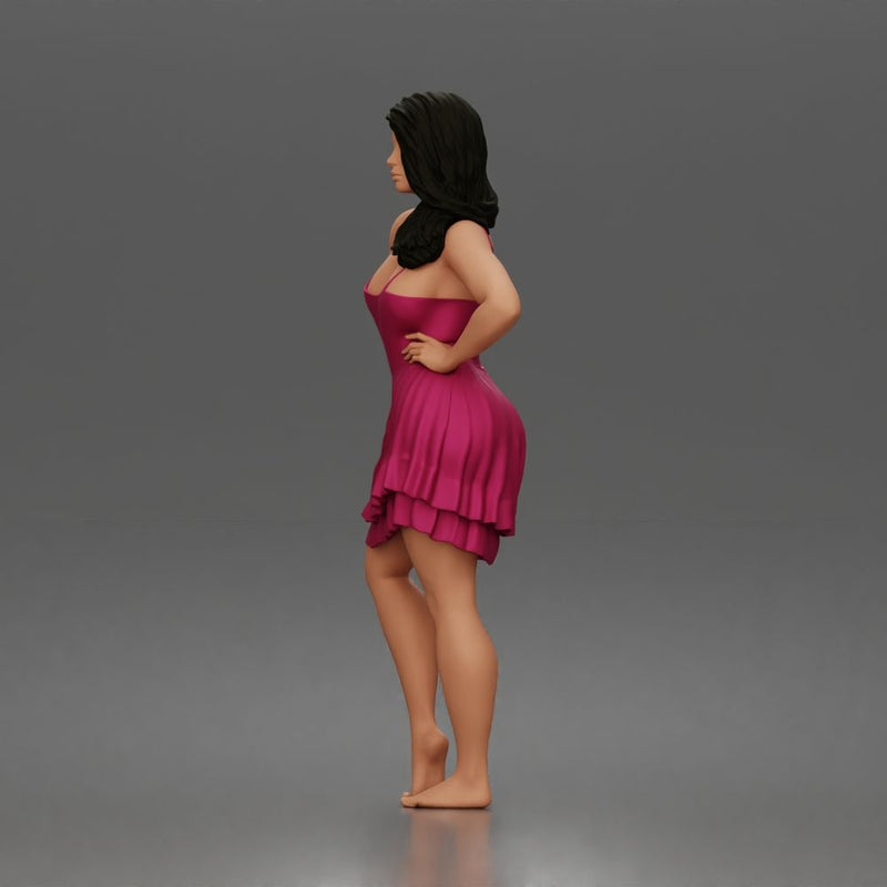 woman posing with hands on hips wearing ruffled dress