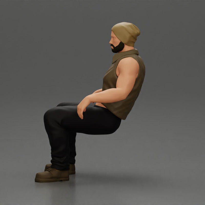Muscular Bearded Man in Beanie Vest Pants Sitting Casually Relaxed - Only-Games