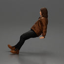 Man with long hair wearing brown jacket sitting with relaxed posture - Only-Games