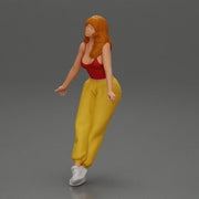 Woman sitting on car in red top yellow pants striking playful pose - Only-Games