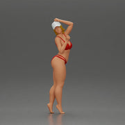 Stylish woman confidently posing in red bikini and white cap - Only-Games