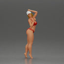 Stylish woman confidently posing in red bikini and white cap - Only-Games