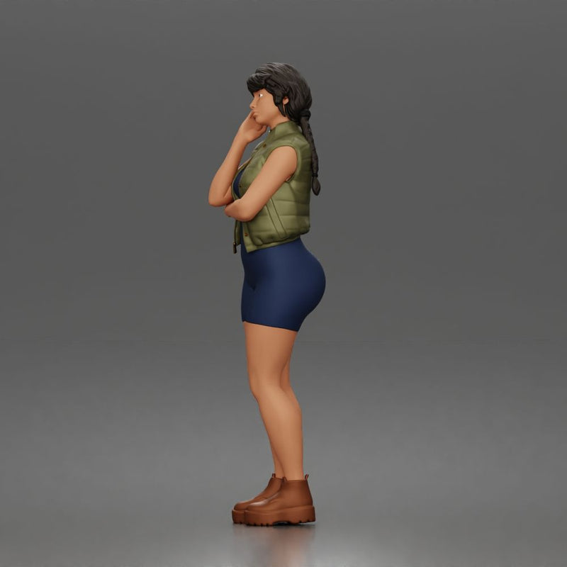 Thoughtful woman stands hand on cheek wearing vest shorts boots - Only-Games