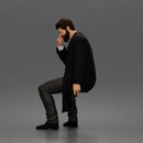 Seated Detective In Long Coat Holding Weapon In Contemplative Pose