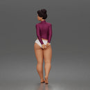 Standing woman looks back long sleeve top underwear bare feet