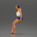 Stylish woman sitting casually in a white top and blue skirt - Only-Games