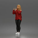 woman pointing upward wearing off shoulder shirt leggings sneakers
